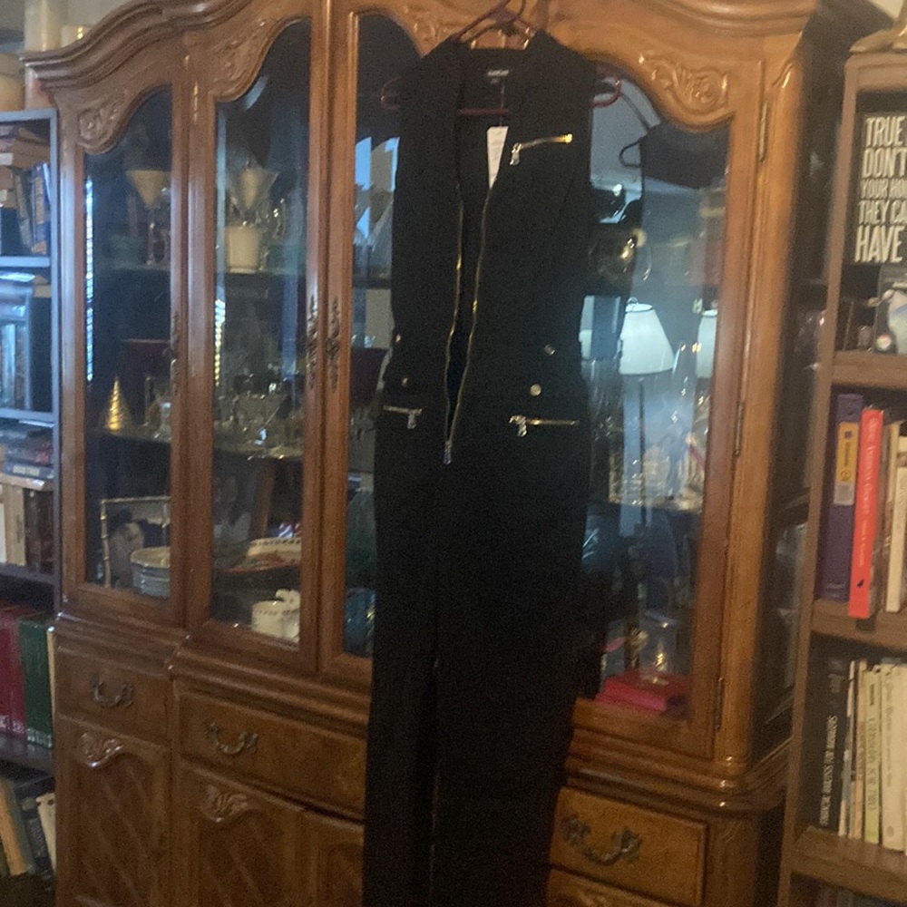 Bebe size 28 (size small US) black jumpsuit with tags brand new.